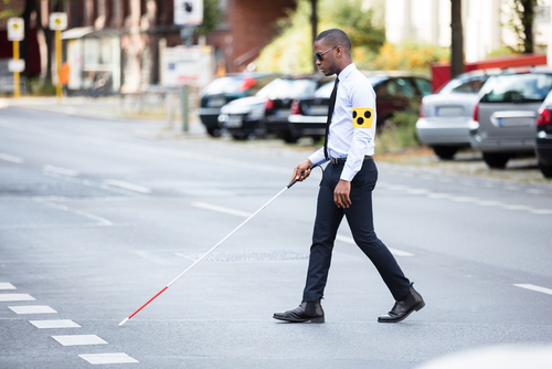Image of African American man using walking stick